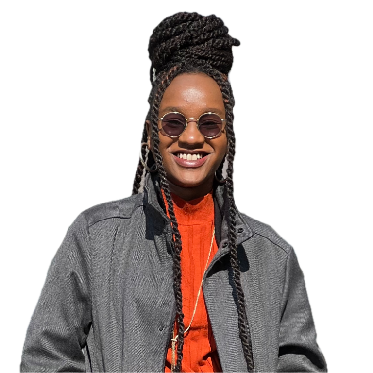 Matilda Mwendwa Gitonga smiling in a grey jacket and orange top.